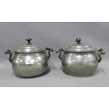 Two early 20th century cooking pots and covers with wooden finials (2)