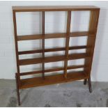 Beaver and Tapley 1950's walnut Penguin bookcase with nine shelves and shaped side supports, 75 x 86