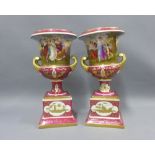 Pair of porcelain campana urn vases with figural panels, puce ground and gilt highlights,on square