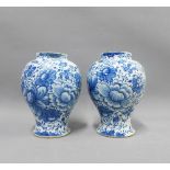 Pair of antique Delft blue and white floral patterned vases, (a/f with restorations) 18cm (2)