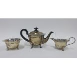 George V silver three piece teaset, Viners, Sheffield 1921, together with silver sugar nips (4)