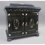 Chinese ebonised and mother of pearl inlaid table top cabinet / box, the domed lid opening to reveal