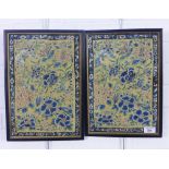 A pair of late 19th / early 20th century embroidered chinoiserie panels, framed under glass, sizes