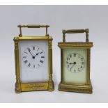 Two brass cased carriage timepieces, one with presentation plaque dated 1884, tallest 17cm,