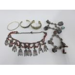 Three Eastern silver bangles, an Indian silver necklace, earrings and two Indian silver bracelets (