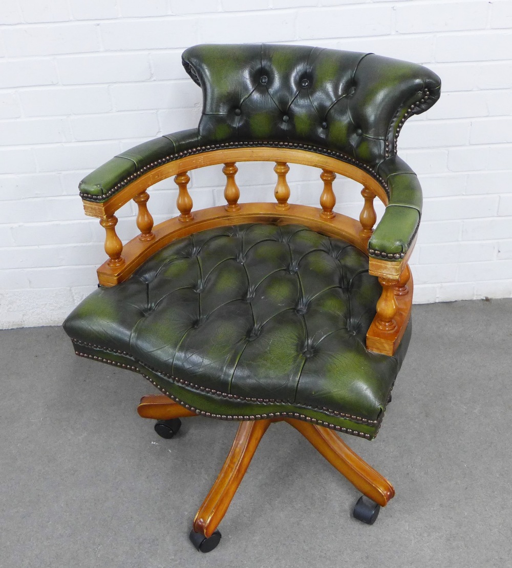 Reproduction green leather swivel captain's chair 62 x 86 x 51cm.