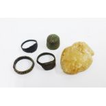 Three bronze rings of Medieval appearance and a carved alabaster Pilgrimage stone - heart shaped