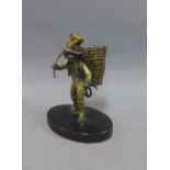 Bronze patinated metal Rat Catcher figure, on an ebonised hardstone base, 11cm