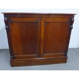 19th century mahogany cabinet with a rectangular top over two cupboard doors flanked by scroll