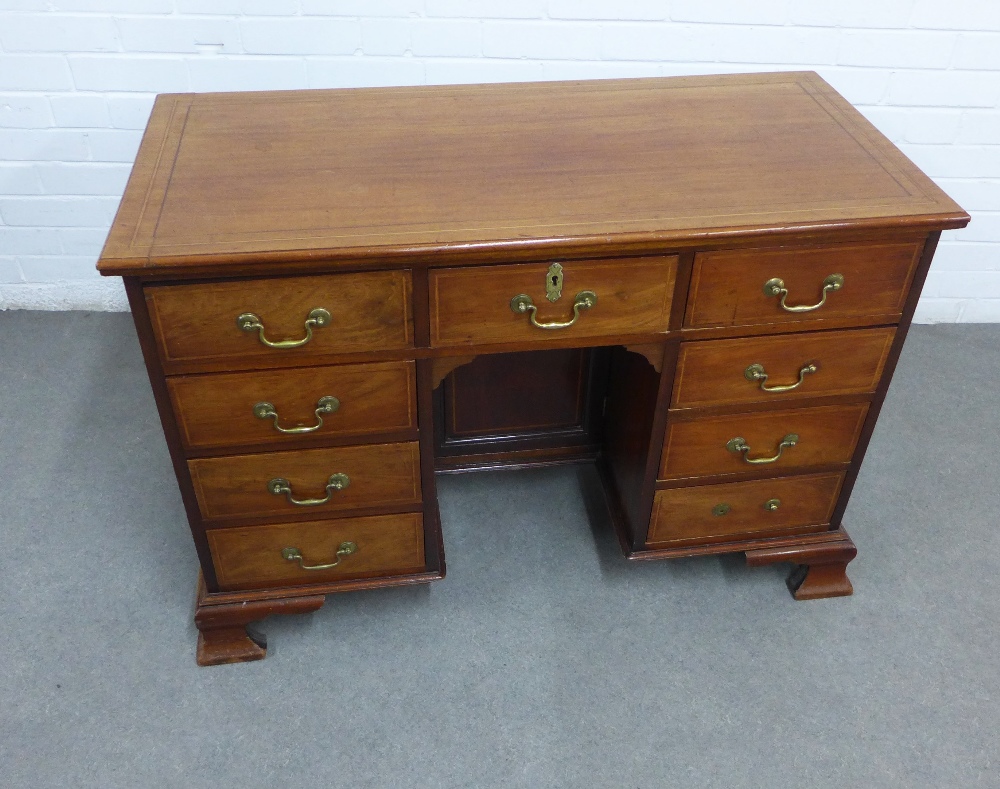 19th century mahogany and inlaid kneehole desk with an arrangement of nine drawers, with a