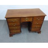19th century mahogany and inlaid kneehole desk with an arrangement of nine drawers, with a
