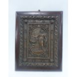Bronze panel with a classical female figure and brazier, on a mahogany plaque, 31 x 25cm