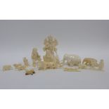 Early 20th century ivory three part figure group and a small collection of carved bone figures,
