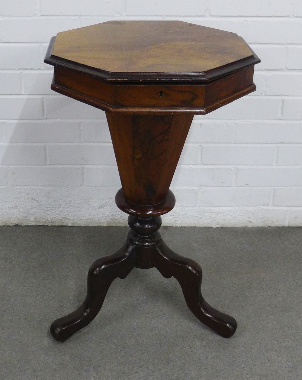 19th century walnut sewing table, octagonal lift up top and column, on tripod legs 43 x 71cm.