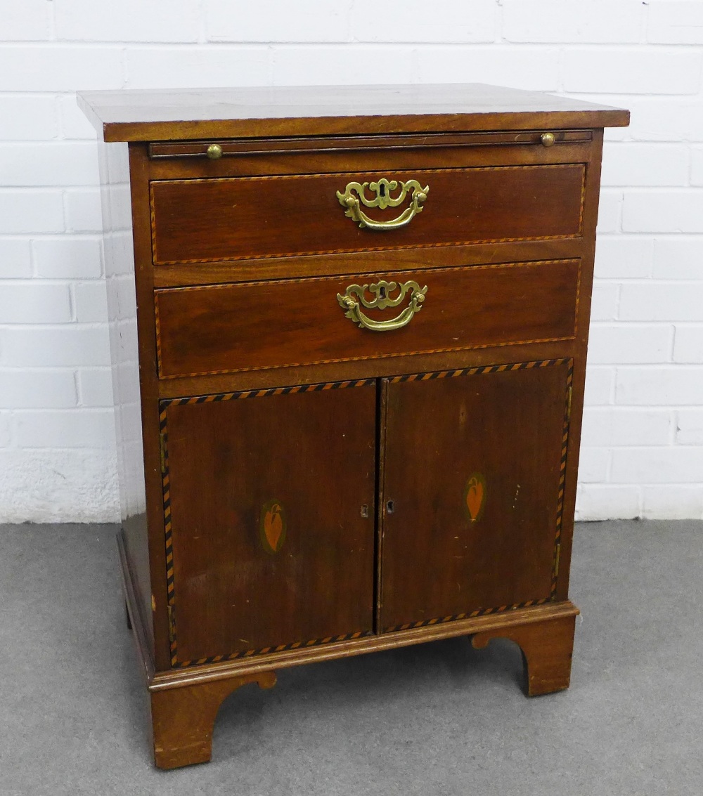 Mahogany bachelor's chest, with shell marquetry and striped banding. Two drawers, a slide, and