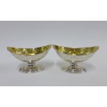 A pair of George III silver gilt salts, William Abdy I, London 1788, with boat shaped bowls and