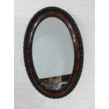 Early 20th century oval wall mirror 54 x 82cm.