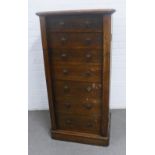 Oak Wellington chest with seven drawers, 59 x 114 x 40cm.