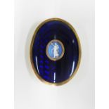 Early 19th century yellow metal buckle with blue enamel and an oval Wedgwood Jasper plaque,
