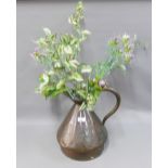 Copper harvest jug with artificial thistles and ivy