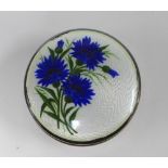 George V silver and enamel box, the circular lid with a pattern of cornflowers, Laurence Emanuel