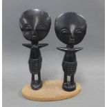 Nigerian wooden figures on a single base, 19cm