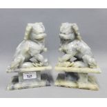 Pair of grey carved soapstone Temple Lion / Dogs on rectangular plinth bases, 19cm (2)