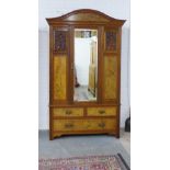 Late 19th / early 20th century mahogany and walnut mirror door wardrobe, arched dentil top and