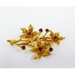 9ct gold garnet flower spray brooch, stamped 375, 5cm long