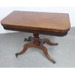 Early 19th century rosewood and ebony banded fold over tea table with a reeded frieze, on a baluster