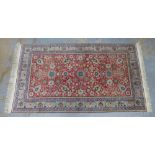 Eastern rug with red floral field, palmette borders, 260 x 148cm