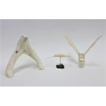 Marine ivory carvings to include a sword fish on a green hardstone base, an owl and a polar bear,