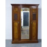 Late 19th / early 20th century mahogany and walnut wardrobe, stepped cornice over a central mirror