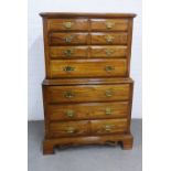 Modern chest on chest with rectangular canted top over seven drawers, on drawer stamped 'Fabrique au
