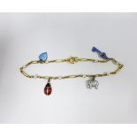 Gold bracelet with pearl spacers, hung with a four silver and coloured enamel charms, the clasp