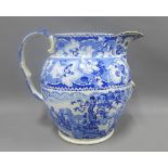 19th century Staffordshire pottery blue and white transfer printed footbath jug, with losses and
