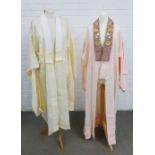 Two silk Kimonos, one in cream with a cloud pattern, the other in pink with an embroidered collar