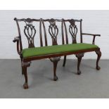 Reproduction Chippendale style three chair back settee with shell carved top rail and interlaced
