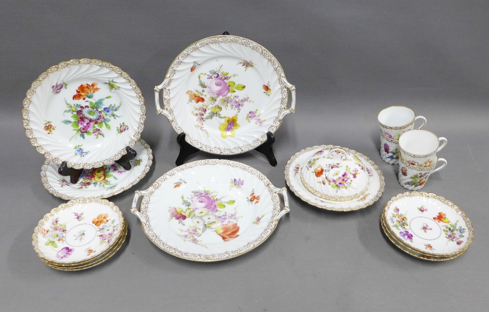 Collection of handpainted Dresden floral pattern porcelain to include two cake plates, muffin dish