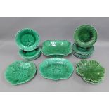 Collection of 19th century Wedgwood and other green glazed plates and serving dishes, all