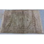 Ghordes style silk rug, faded cream ground with central grey lozenge, 176 x 117cm