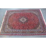 Iranian Pamchal carpet, red ground with ivory medallion and allover floral pattern, 358 x 248cm