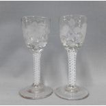 A pair of 18th century Jacobite engraved wine glasses with enamel spiral twist stems, 13cm (2)