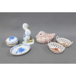 Collection of Herend porcelains to include small baskets, a blue and white jar and cover and a pin