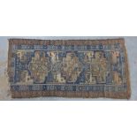 Persian rug, blue worn field with three medallions and flowerhead borders, 212 x 107cm (a/f)