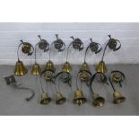 Set of eleven brass and black painted metal servants bells together with a wall light (12)