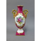French Decor Main porcelain urn vase with handpainted flowers against a puce ground, with gilt