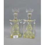 Pair of clear moulded glass table lustre's on square cut bases, 24cm