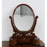 Mahogany dressing table mirror with an oval swing plate and scrolling side supports, three drawers