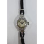 Cyma Art Deco platinum cased wrist watch, with diamond stepped case and black cord strap